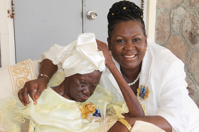 Celian “Martin” Powell of Zion Village, the Federation’s oldest citizen with her granddaughter Erma Skelton at her 105th birthday celebration hosted by her family on January 19, 2017 at the Flamboyant Nursing Home